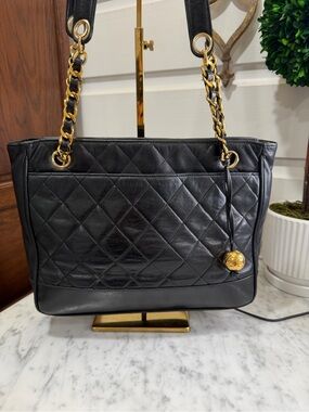 CHANEL Black Quilted Leather Shoulder Bag with Gold Chain Detail